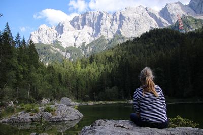 Rear view of woman looking at mountains