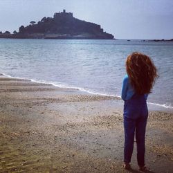 Woman standing on beach