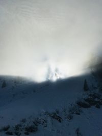 Scenic view of mountains against sky during winter