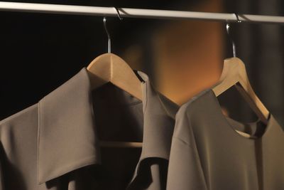 Close-up of clothes hanging on rack in store