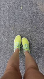 Low section of man standing on ground