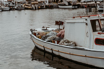 Boats moored at harbor