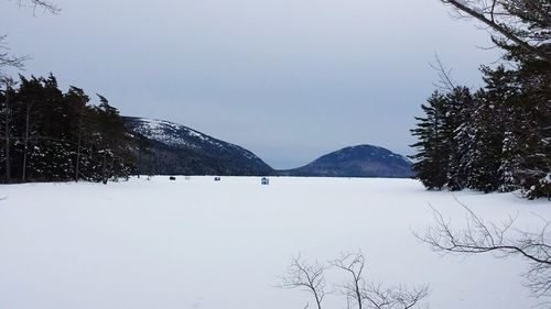 Scenic view of snow covered mountains