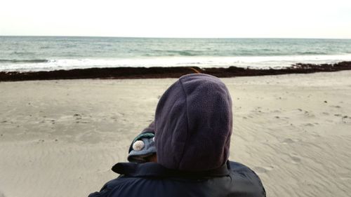 Rear view of man on beach