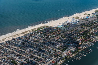 Aerial view of buildings by sea