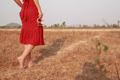 Woman standing on field