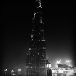 Low angle view of skyscrapers lit up at night