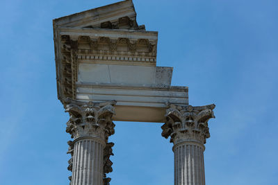 Low angle view of historical building against blue sky