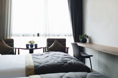 Empty chair by window at home