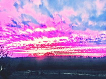 Scenic view of pink land against sky at sunset