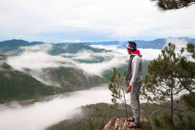 High angle view of man standing against mountains