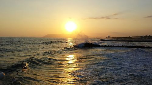 Scenic view of sea against sky during sunset