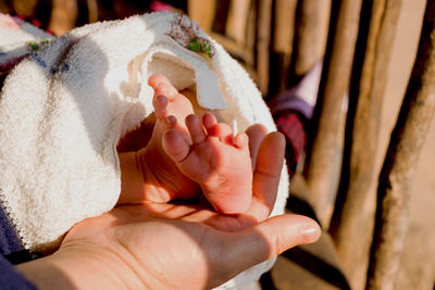 Close-up of woman hand with baby