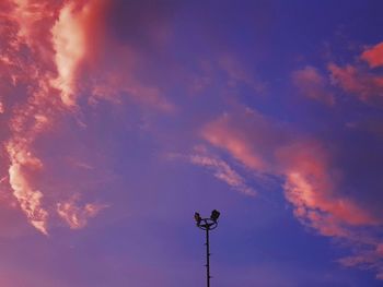 Low angle view of street light against sky