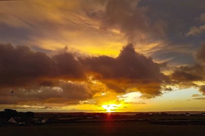 Scenic view of dramatic sky during sunset