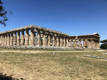 Exterior of temple against clear blue sky