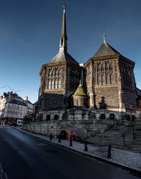 Low angle view of church against blue sky