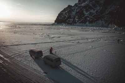 Old vans over frozen baikal lake