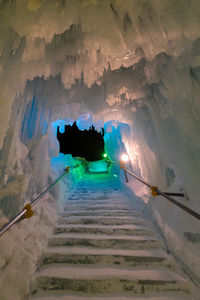 Low angle view of illuminated tunnel