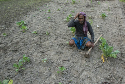 Portrait of man sitting on land