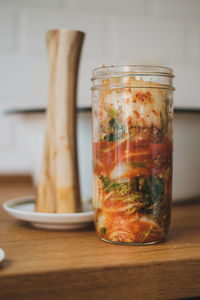 Close-up of glass jar on table