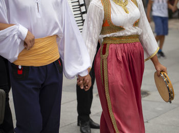 Midsection of people standing in temple