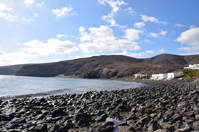 Scenic view of beach against sky