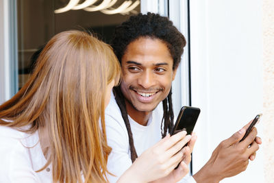 Portrait of woman holding smart phone