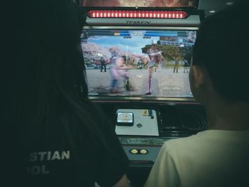 Rear view of people traveling in train