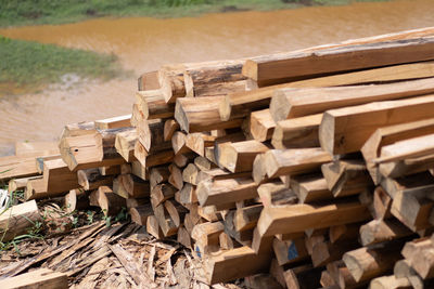 Stack of logs on field