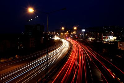 High angle view of light trails on road at night