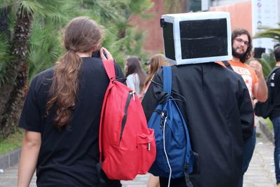 Rear view of people photographing