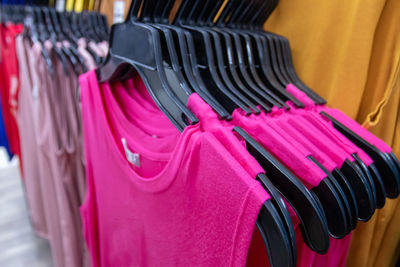 Close-up of clothes rack at store