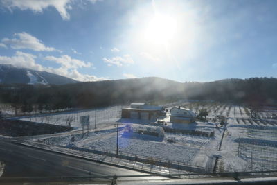 Panoramic view of mountains against sky on sunny day