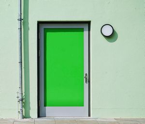 Closed green door of building