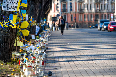 Flowers, candles and posters in support of ukraine in front of the embassy of ukraine in riga