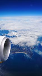 Aerial view of aircraft wing over sea