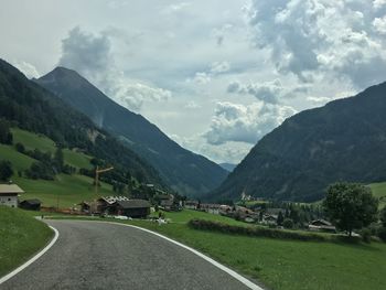 Scenic view of landscape and mountains against sky