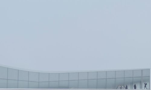 Low angle view of modern building against clear sky