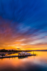 Scenic view of sea against sunset sky