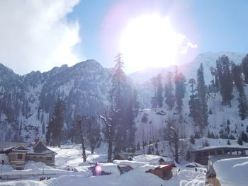 Scenic view of snow covered mountain against sky