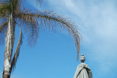 Low angle view of statue against sky