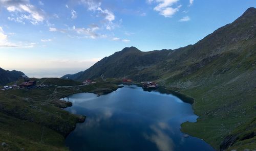 Scenic view of lake and mountains against sky