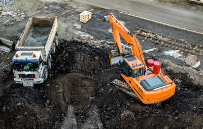 Sibiu, romania - november 16, 2019. excavator loads earth into the dump truck