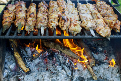 High angle view of meat on barbecue grill