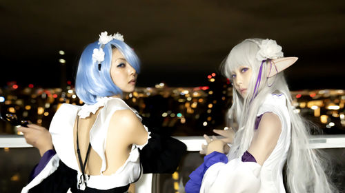 Young women wearing costume at night