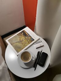 High angle view of coffee cup on table