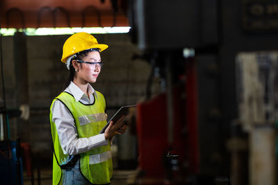 Woman working at construction site