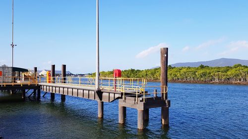 Pier on lake against sky