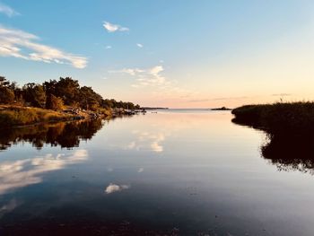 Scenic view of lake against sky during sunset